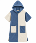 A short-sleeve hooded zip-front towel or robe in a color-blocked design, featuring blue and cream panels with two large front pockets, shown on a plain white background.